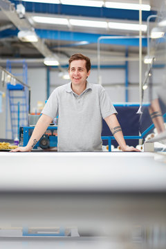 Portrait of factory worker in roller blind factory