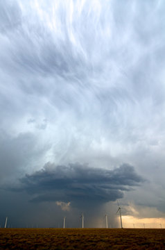 A beautiful updraft seen in a storm behind a field of wind turbines in eastern Colorado, USA