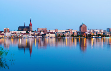 Night Panorama view to Rostock. River Warnow and City port. - obrazy, fototapety, plakaty