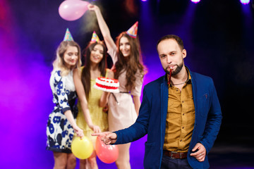 Happy birthday! Group of smiling friends gathered together with