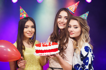 Happy birthday! Group of smiling friends gathered together with