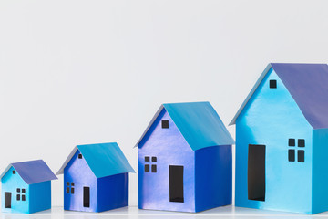 blue paper houses on white background