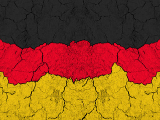 Flag of Germany on rugged wall full of scratches - metaphor of problem and crisis leading to...
