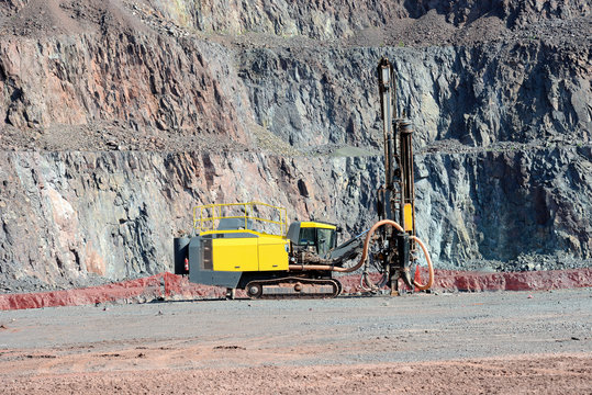 Driller in an open pit mine