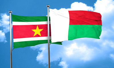 Suriname flag with Madagascar flag, 3D rendering