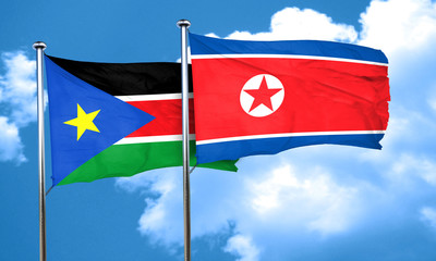 south sudan flag with North Korea flag, 3D rendering