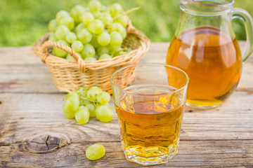 Grape juice in the glass and pitcher 