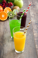 Fresh fruit smoothies on a rustic wooden table

