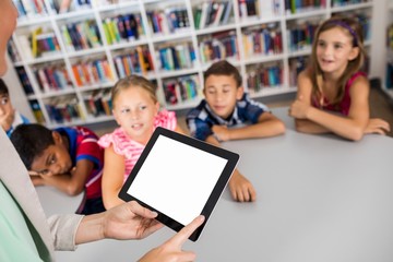 Close up view of a tablet hold by a teacher