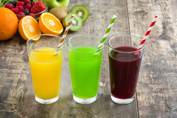 Fresh fruit smoothies on a rustic wooden table

