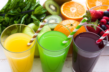 Fresh fruit smoothies on a white wooden background

