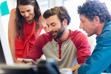 Colleagues working with a tablet