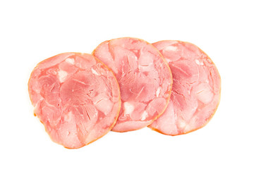Fresh sliced smoked ham isolated on white background