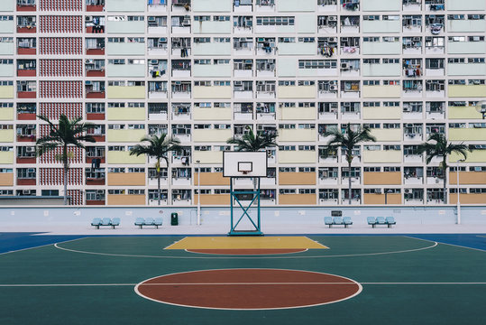 Urban Oasis - Basketball court on a pastel skyscraper front.