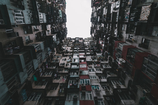 Caged life - Looking up courtyard of extremely dense residential building.