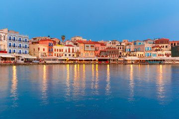 Naklejka na ściany i meble Venetian quay of Chania during twilight blue hour, Crete, Greece