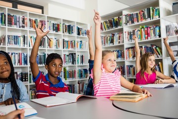 Pupils raising their hands 