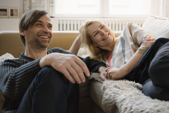 Happy mature couple spending leisure time at home