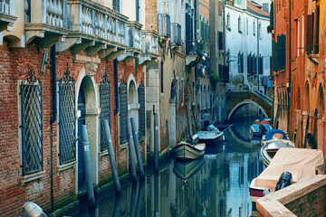 Obraz na płótnie Canvas Venice, Italy - October 28, 2014: View Canal with boats from bridge in Venice, Italy. Venice is a popular tourist destination of Europe.