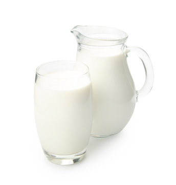 Jug and glass of milk isolated on white background with clipping path.