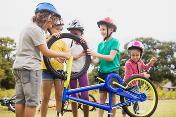 Children playing with bike in the park