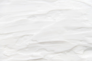 Cosmetics. Cream white background texture.