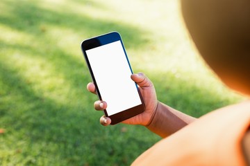 Kid using smartphone during a sunny day