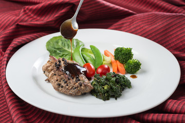 Food series : Grilled chicken breast with black pepper, served with fresh vegetable