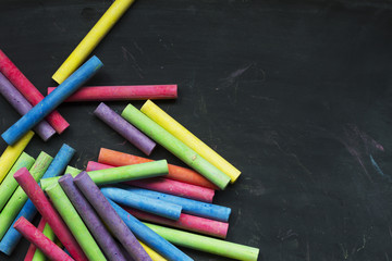 Colored chalk on a blackboard background