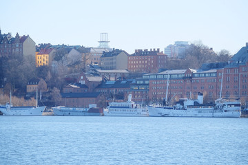 Fototapeta na wymiar Stockholm, Sweden - March, 16, 2016: panorama of Old Town of Stockholm, Sweden, with the boats on a sea