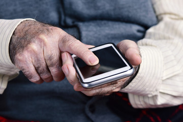 old man using a smartphone