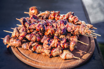 meat kebab skewers on the grill, chicken hearts,