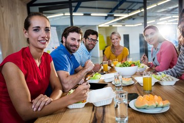 Casual business team eating together