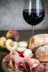 Red wine with prosciutto and ciabatta