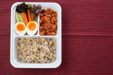 Food series : Spicy chicken and tomato dip, served with brown rice and fresh vegetable, Thai foods, northern style