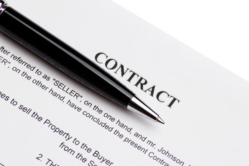 Close-up of pen on contract 