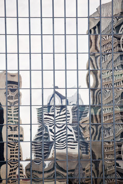 Buildings reflected in mirrored windows of office building, Brisbane, Australia