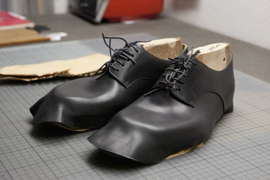 A pair of shoes being made