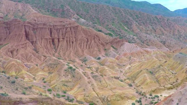 Aerial video of uranium deposits in red rocks. Kyrgyzstan