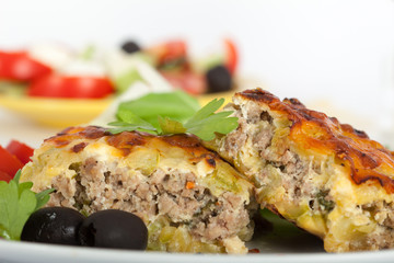 Moussaka - casserole of minced meat and vegetables, topped with cheese and bechamel sauce