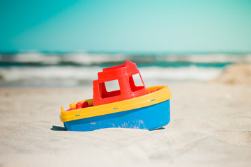 toy ship on the beach