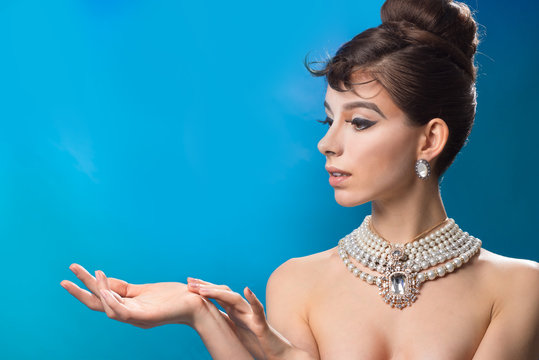 Girl holds something on the palm