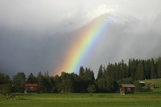 A rainbow in front of the Rhone Glacier, Valais Canton, Switzerland