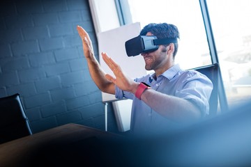 Businessman using virtual reality device