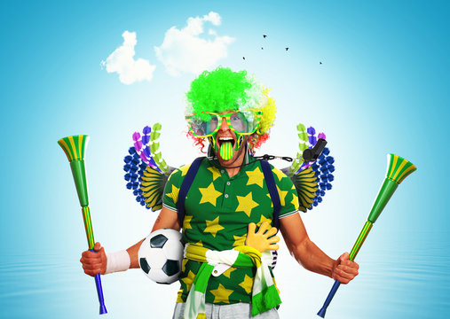 Brazil football fan in a red wig and horns