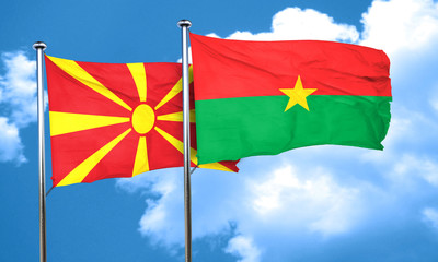 Macedonia flag with Burkina Faso flag, 3D rendering