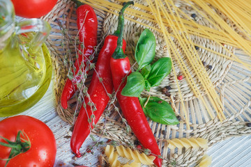 Italian food background, with tomatoes, basil, pasta, olive oil,