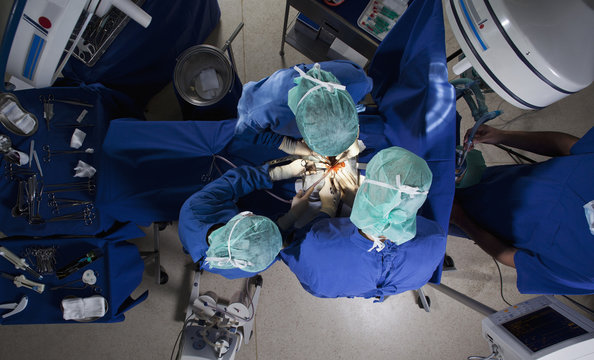 High angle view of a surgery team operating on a patient