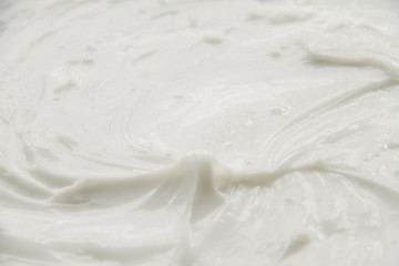 Cosmetics. Cream white background texture.