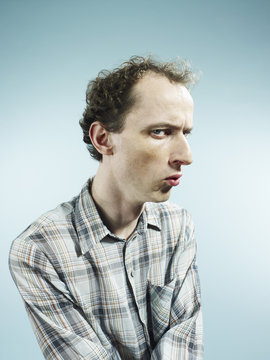 A man looking suspiciously at the camera